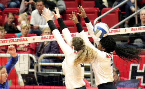 Freshman Marie Plitt (left) and Redshirt Freshman Esther Grussing (right) attempt to block the volleyball from crossing over the net in the Ball State vs. Buffalo Women's volleyball game in Worthern Arena in Muncie, IN, on Saturday, November 2, 2019. Grussing recieves a blow to the head by the volleyball. (Jennifer McGowen/J 235).