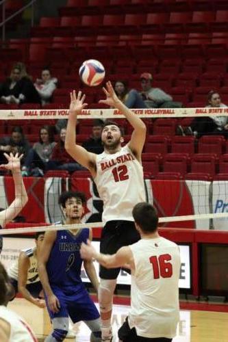 Senior Jake Romano, Number 12, prepares to hit the ball over the net in the Ball State vs. Urbana Men’s Volleyball game in Worthen Arena in Muncie, IN on Thursday, February 6, 2020 (Jennifer McGowen). 
